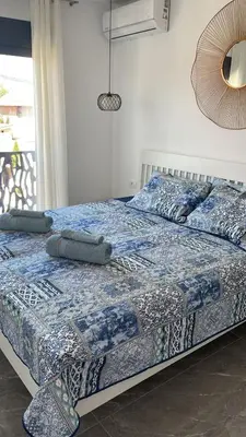 a bed with pillows on it in a bedroom at Vila Palace 4S next to Plaza in Donji Štoj