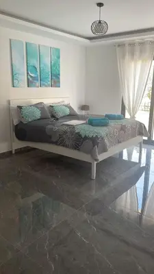 a bedroom with a large bed in a room at Vila Palace 4S next to Plaza in Donji Štoj