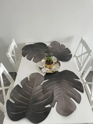 a table with a plate of food on top at Vila Palace 4S next to Plaza in Donji Štoj