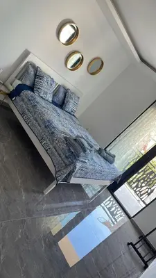a bedroom with a large bed in the ceiling at Vila Palace 4S next to Plaza in Donji Štoj
