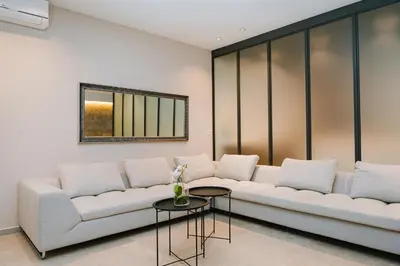 a living room with a couch and a table at Kondo Hotel Allure in Budva