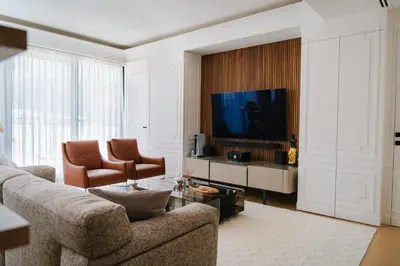 a living room with a couch and a television at Kondo Hotel Allure in Budva