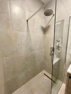 a shower with a glass door in a bathroom at Casa Al Mare Lena Seaside in Budva