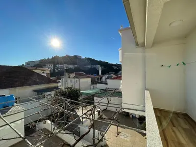 a view from a balcony with birds flying in the sky at Apartmani centar ulcinj in Ulcinj