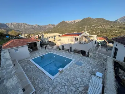 an aerial view of a house with a swimming pool at Villa Tunaj new Pool and BBQ in Bar