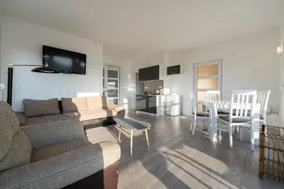 a living room with a couch and a table at Regina Residence in Budva