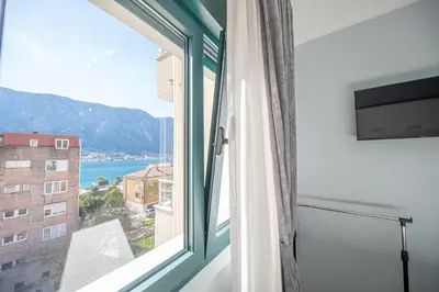 a window in a room with a view of the ocean at Lena apartment 2 in Kotor