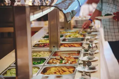 a buffet line with many different types of food at Hotel Montenegro in Budva