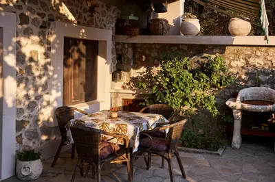 a table and chairs sitting on a patio at Apartments 