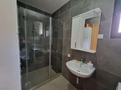a bathroom with a sink and a shower at Your second home in Podgorica in Podgorica