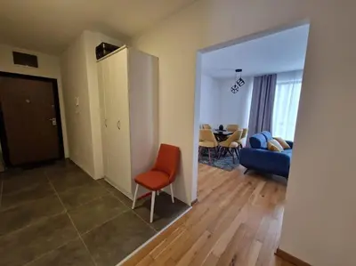 a living room with a couch and a chair and a table at Your second home in Podgorica in Podgorica