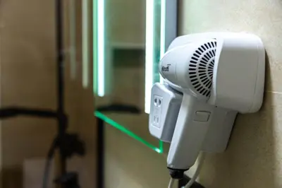 a hair dryer is attached to a wall at Sand Apartments in Ulcinj