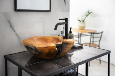a wooden sink sitting on top of a table at ZEN Relaxing Village in Cetinje
