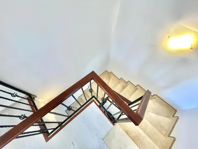 a staircase in a building with a light on the ceiling at Villa Serenity Budva in Budva