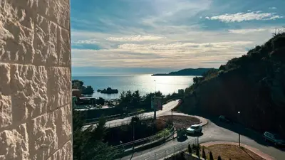 a view of the ocean from a building at Apartment Ra Przno Budva in Budva