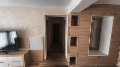 a room with a wall with a mirror and a television at Apartment Ra Przno Budva in Budva