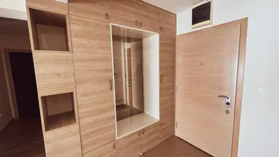 a wooden closet with a glass door in a room at Apartment Ra Przno Budva in Budva