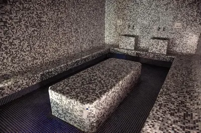 a room with a bed in the middle of it at Avala Resort & Villas in Budva