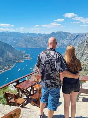 a man and a woman standing on top of a mountain at Top floor with stunning seaview, first line in Rafailovici