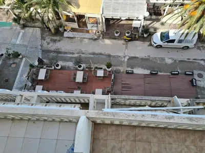 an overhead view of a building with a parking lot at Top floor with stunning seaview, first line in Rafailovici