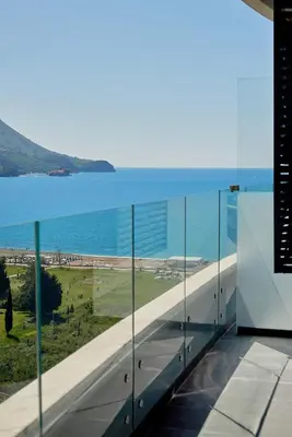 a view of the ocean from the balcony of a building at Skyline resort in Becici