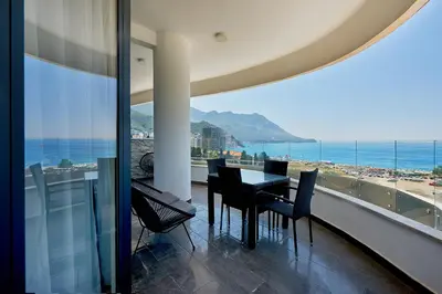 a dining room with a view of the ocean at Skyline resort in Becici