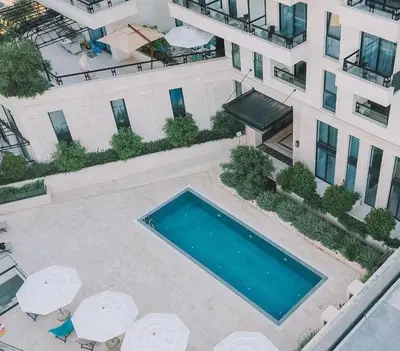 an overhead view of a swimming pool in front of a building at Luxury apartment Casa Al Mare in Rafailovici