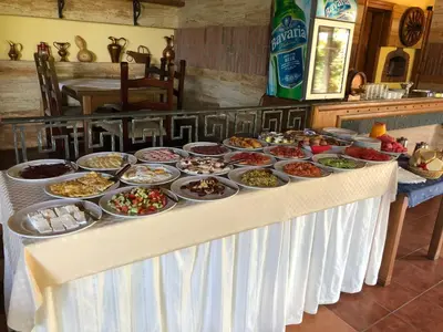 a buffet of food on a table in a kitchen at Firenze Apartments in Ulcinj