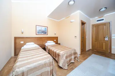 a room with two beds in a room at Hotel Stella di Mare in Budva
