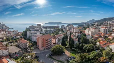 an aerial view of a city with buildings at Hotel Stella di Mare in Budva
