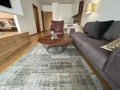 a living room with a couch and a coffee table at Apartments Lux in Budva