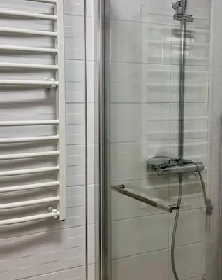 a shower with a glass door in a bathroom at Paradise beachfront view 1 in Bar