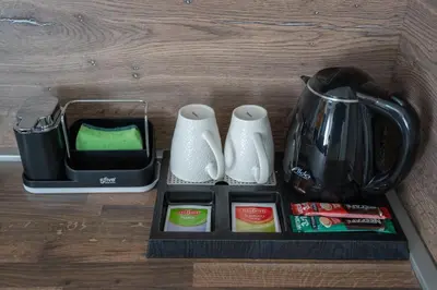 a counter top with a coffee maker and a blender at Marea DeLuxe Apartments in Kotor