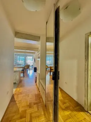 an open door in a room with a wooden floor at Sea view Studio Terminal in Budva
