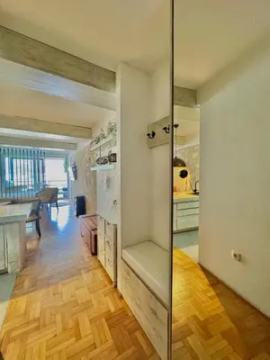 a room with a kitchen and a dining room at Sea view Studio Terminal in Budva