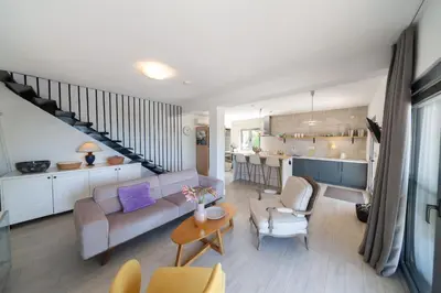 a living room with a couch and a table at Villa Mattson in Budva