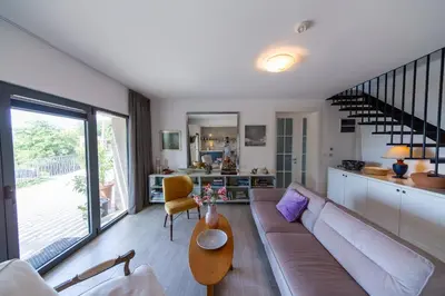 a living room with a couch and a table at Villa Mattson in Budva