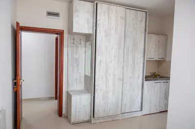 a kitchen with a large sliding glass door at Villa Erik in Ulcinj