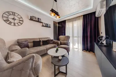 a living room with a couch and a table at Sailor's Knot Apartment - Central and Amazing Sea View in Kotor