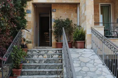 a staircase leading up to a house with plants at Diva Petra Apartments in Budva