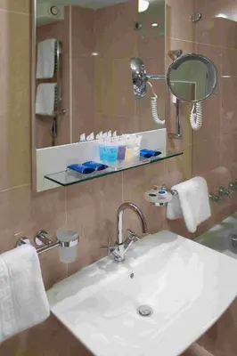 a bathroom with a sink and a mirror at Monte Casa SPA & Wellness in Petrovac na Moru
