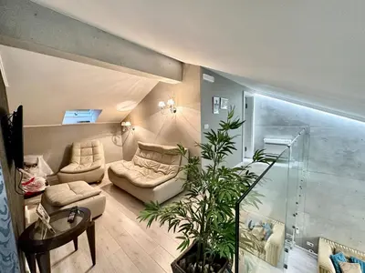 a living room with a couch and a table at Lux Apartment Budva in Budva