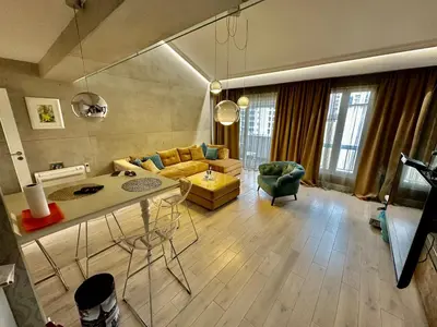 a living room with a couch and a table at Lux Apartment Budva in Budva
