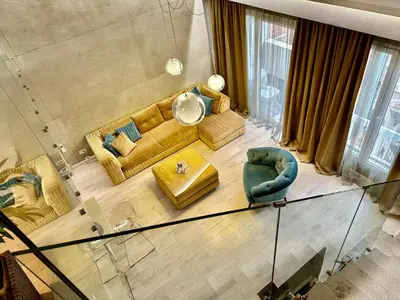 an overhead view of a living room with a couch and chairs at Lux Apartment Budva in Budva