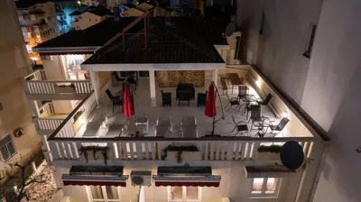 an aerial view of a building with tables and umbrellas at Villa Maxima Budva in Budva