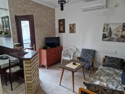a living room with a couch and a table at Apartman Nadja - Sutomore in Sutomore