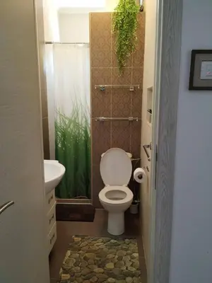 a bathroom with a toilet and a sink at Apartman Nadja - Sutomore in Sutomore