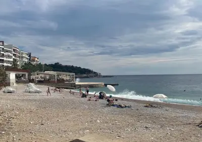 a group of people laying on a beach at Apartment SuSe in Dobra Voda