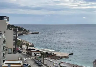 a view of the ocean from a building at Apartment SuSe in Dobra Voda