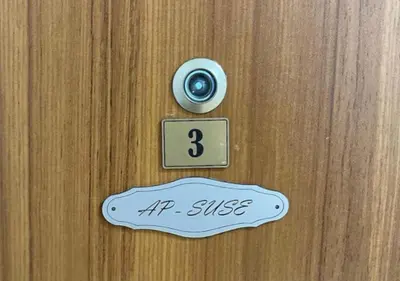 a door with a door knob and a sign on it at Apartment SuSe in Dobra Voda